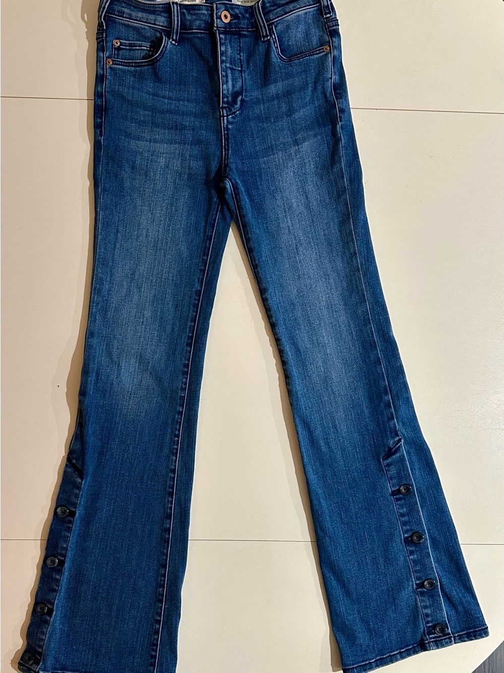 Anthropologie Pilcro flared jeans with button accent on the lower leg SIZE 26”